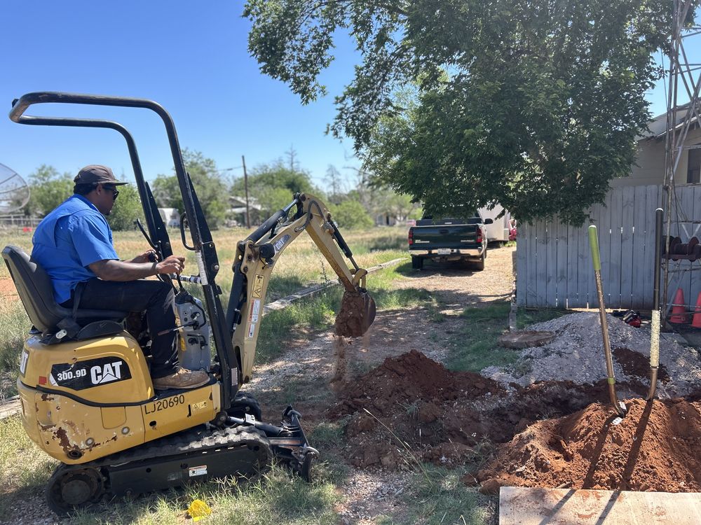 Double R Plumbing owner running equipment on a job site